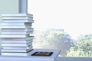 E-reader and stack of book lying on a table in front of a window, 3D Rendering