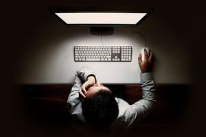 Bird's eye view of man on a computer