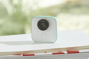The Google Clips camera sitting on top of a stack of textbooks