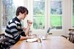 Young man works at home