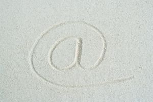 At symbol traced in sand, close-up