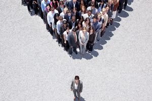 Businesswoman and crowd of people behind her
