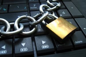 A padlock on a laptop keyboard.