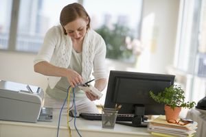 Woman plugging in router