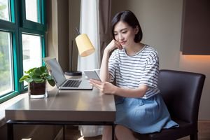 Woman using smartphone for work