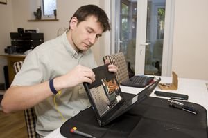 Man repairing laptop